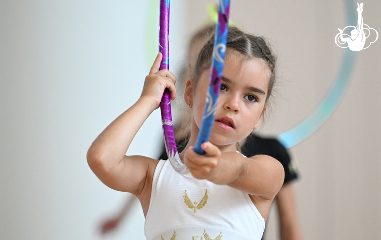 Gymnast from the Amur Tiger society during an exercise with a hoop