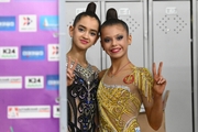 Anna Vakulenko and Karolina Tarasova before going out on the floor  Gymnast during an exercise with a hoop