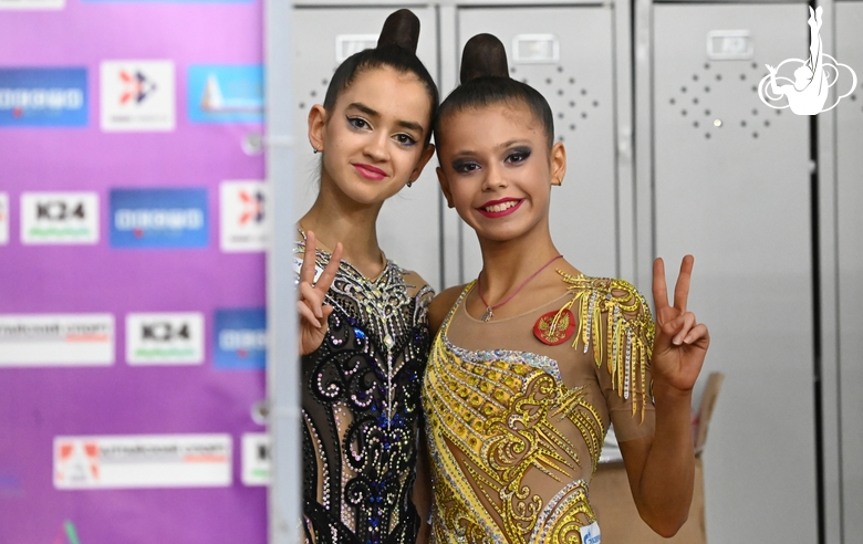 Anna Vakulenko and Karolina Tarasova before going out on the floor  Gymnast during an exercise with a hoop