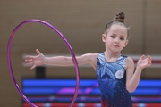 Young gymnast during an exercise with a hoop at the mAlinka tournament