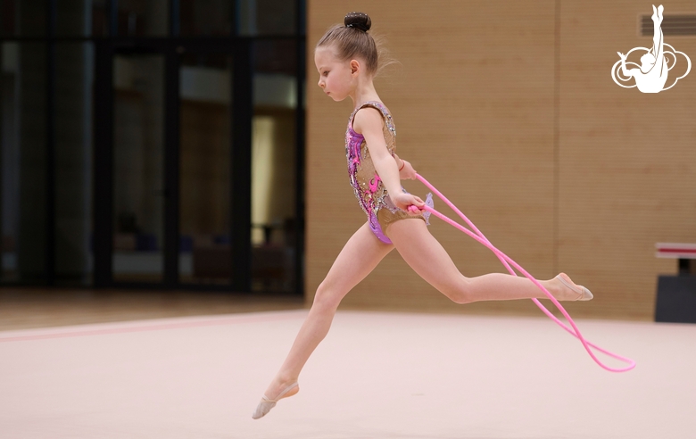 Young gymnast during the workout