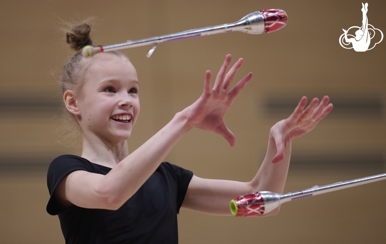 Kristina Voitenko during an exercise with clubs