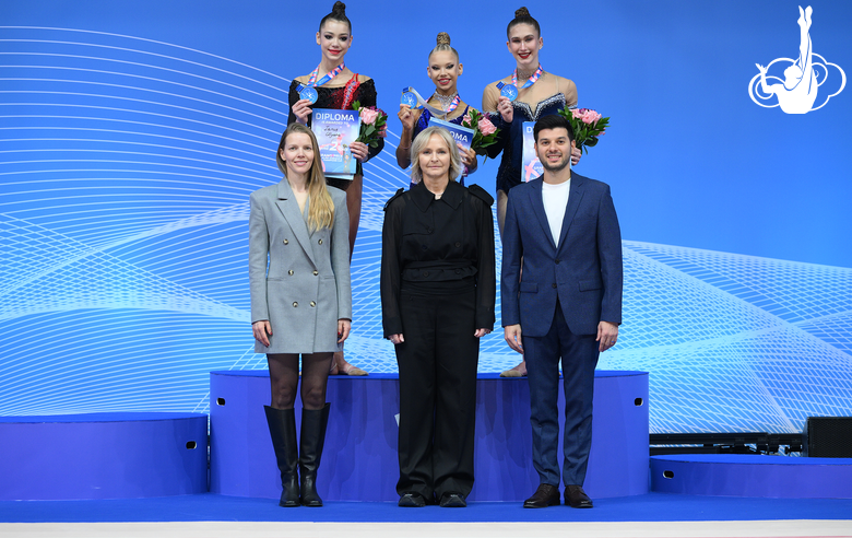 The podium of the final with a ribbon