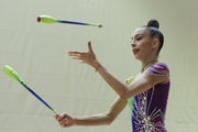 Gymnast during an exercise with clubs