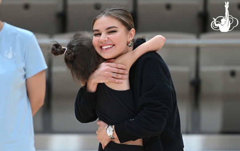 Olympic champion Alina Kabaeva with a young gymnast