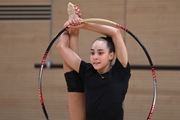 Gymnast during an exercise with a hoop during floor testing