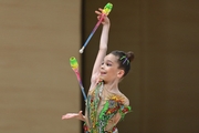 Daria Prikhodko with clubs during a solo performance