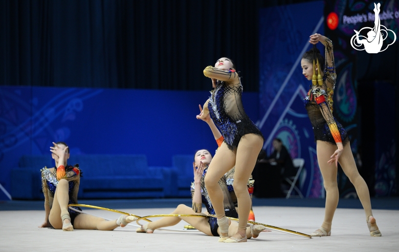Team China during an exercise with hoops and clubs