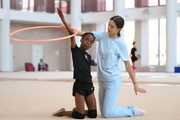 Academy coach Elizaveta Chernova with gymnast Nkenko Sita Davina Chanselvi during the training session