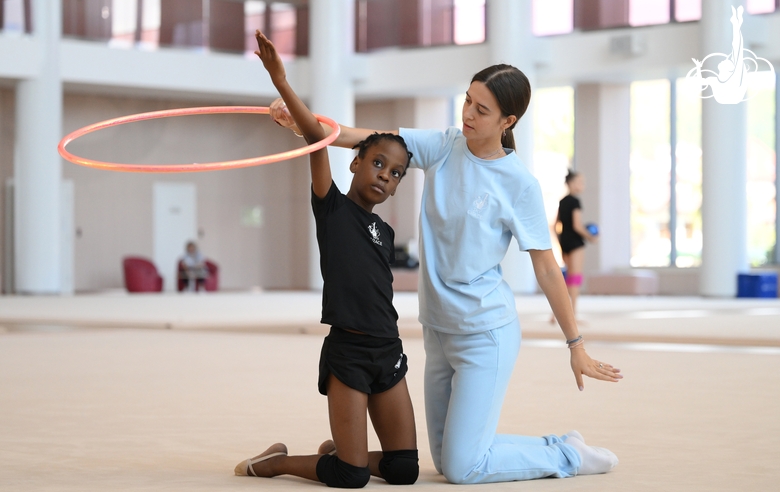 Academy coach Elizaveta Chernova with gymnast Nkenko Sita Davina Chanselvi during the training session