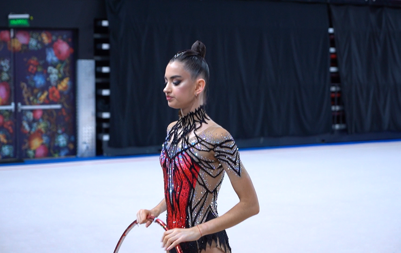 Alina Kabaeva and coach Evgeniya Eliseeva help Anna Vakulenko prepare for her performance at the second stage of the Cup of the Strongest