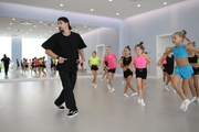 Choreographer Artur Nureev with gymnasts during practice at the training camp in the Academy