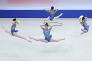 Group exercise gymnasts during the exercise with balls and hoops