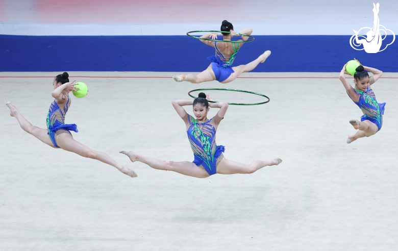 Group exercise gymnasts during the exercise with balls and hoops