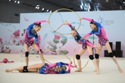 Academy group gymnasts during exercise with hoops