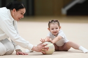 Young gymnast with ball