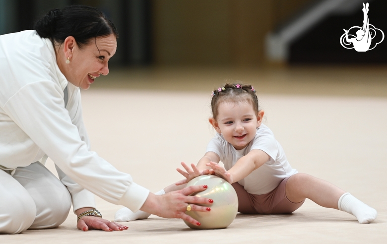 Young gymnast with ball