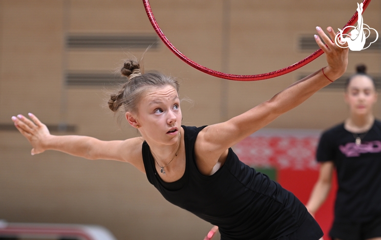 Gymnast during an exercise with a hoop during floor testing