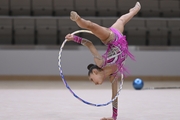 Gymnast performs an exercise with a hoop