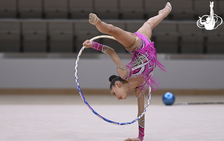 Gymnast performs an exercise with a hoop