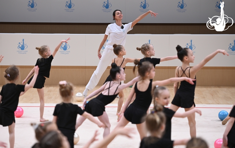 Academy choreographer Ekaterina Belova and Young gymnasts during rehearsal