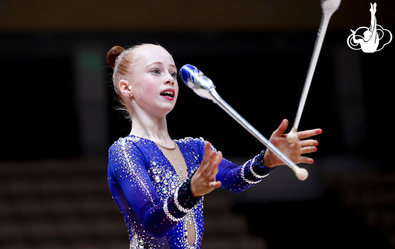 Young gymnast learns a new element during the training camp upon Alina Kabaeva’s advice