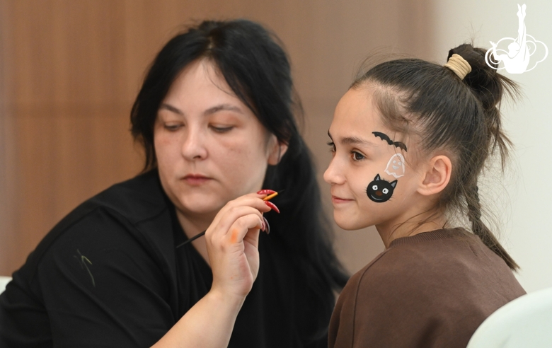 Academy student Valeria Medvedeva in the face painting area