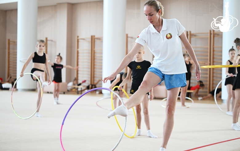 Coach Inna Zhukova and gymnasts during the training session