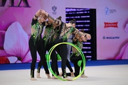 Group team gymnasts from the Omsk region during an exercise with balls and hoops