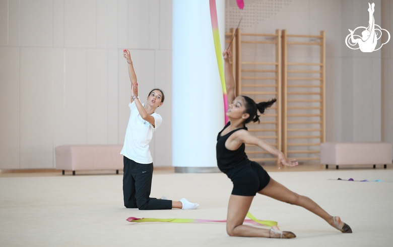 Coach Elizaveta Chernova and gymnast Aryaa Nitesh Kadam during training