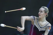 Maria Pobedushkina (Russia)  doing an exercise with clubs