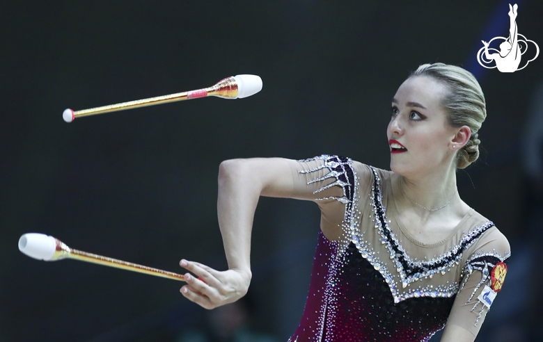 Maria Pobedushkina (Russia)  doing an exercise with clubs