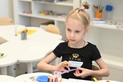 Young gymnast during a lesson in a classroom