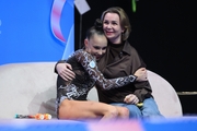 Mariia Borisova with coach Irina Gusarova after an exercise with clubs