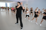 Choreographer Artur Nureev with gymnasts during practice at the training camp in the Academy