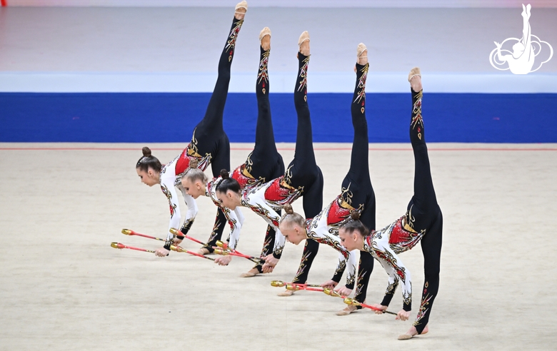 Academy group exercise gymnasts during the exercise with clubs