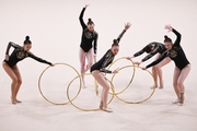 Gymnasts during an exercise with hoops