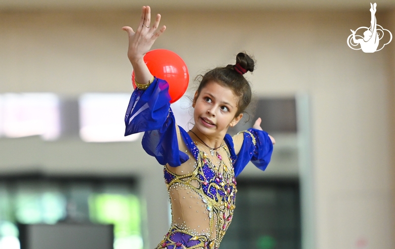 Karolina Tarasova does an exercise with a ball