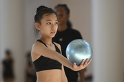 A young gymnast from China during the ball exercise