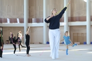 Academy Coach Anna Ustsova with young gymnasts during the exercise