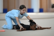 Academy coach Elizaveta Chernova with gymnast Nkenko Sita Davina Chanselvi during the hoop exercise