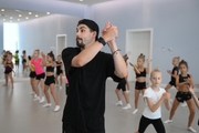 Choreographer Artur Nureev with gymnasts during practice at the training camp in the Academy