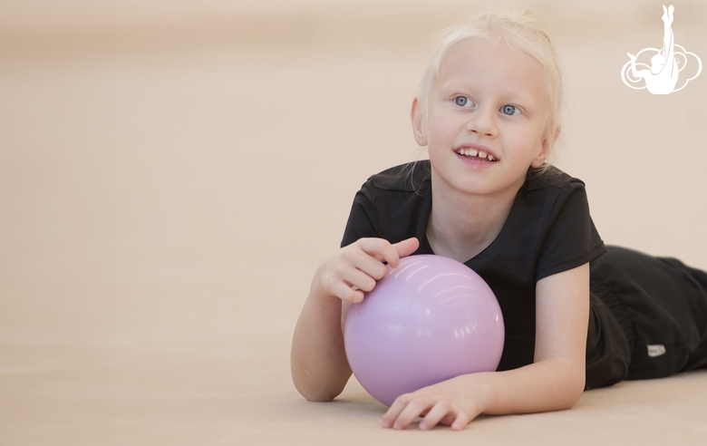 Young gymnast during training