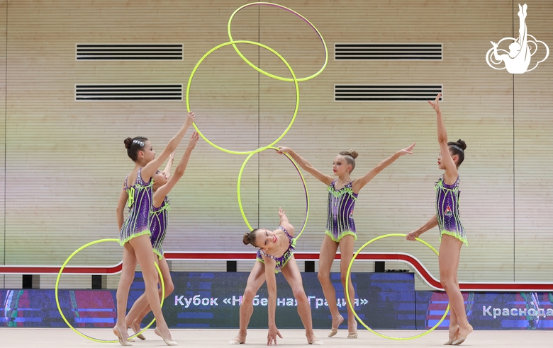 Gymnasts during an exercise with hoops