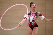 Karolina Tarasova performs a program with a hoop at an assessment training session