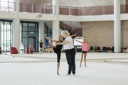 Russia’s Honored Coach Natalya Ovsyannikova works with a young gymnast