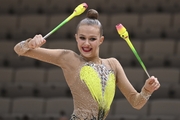 Gymnast during an exercise with clubs