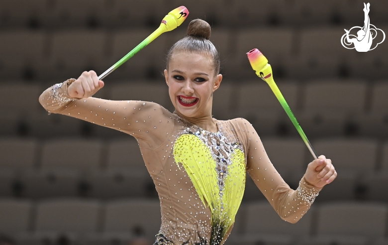 Gymnast during an exercise with clubs