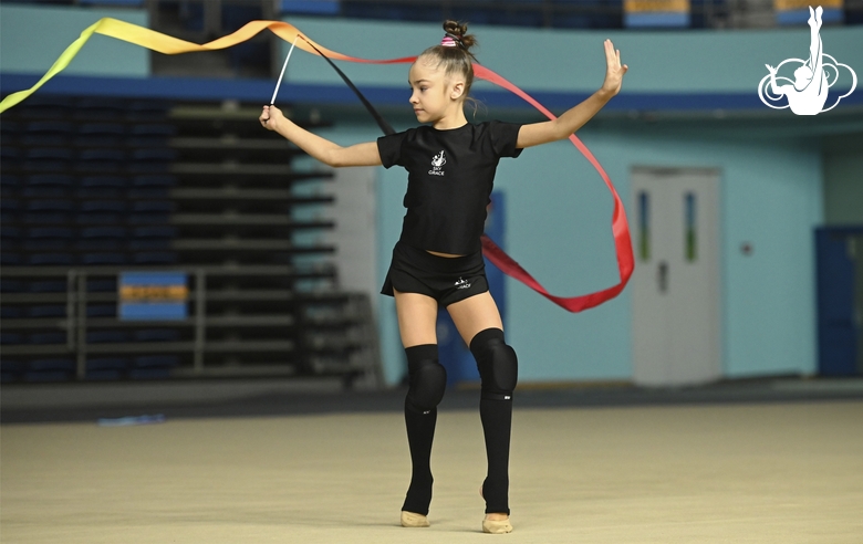 Ksenia Savinova during an exercise with a ribbon at floor testing