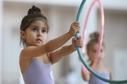 Young gymnast during training